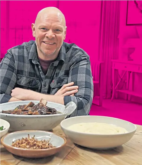  ?? ?? Celebrity chef Tom Kerridge with some dishes he made earlier – beef short rib stew, creamy celeriac and potato mash, braised kale and cavolo nero and crispy shallots – on the set of Sunday Lunch