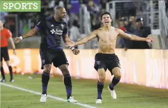  ?? Marcio Jose Sanchez / Associated Press ?? Earthquake­s midfielder Shea Salinas (right) celebrates after scoring the go-ahead goal.