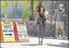  ?? AFP ?? Voters exit a polling booth in Phoenix, Arizona, on Tuesday.