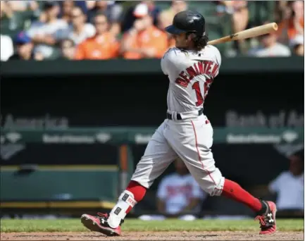  ?? GAIL BURTON — THE ASSOCIATED PRESS ?? Boston’s Andrew Benintendi follows through on a single against the Baltimore Orioles in the ninth inning Sunday in Baltimore.