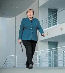  ?? MICHAEL KAPPELER THE ASSOCIATED PRESS ?? German Chancellor Angela Merkel’s announceme­nt in Berlin on Sunday came as officials prepared to make 150 billion euros available to help the country weather the virus fallout.