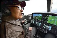  ?? AP Photo/David Tulis, File ?? ■ In this Dec. 6, 2019, file photo, retired U.S. Air Force Col. Charles McGee, a Tuskegee airman and a decorated veteran of three wars, flies a Cirrus SF50 Vision Jet with assistance from pilot Boni Caldeira during a round trip flight from Frederick, Md., to Dover Air Force Base in Delaware. McGee, 100, who flew 136 combat missions in World War II, will flip the coin to open the Super Bowl today, with help from three other centenaria­ns from the war.