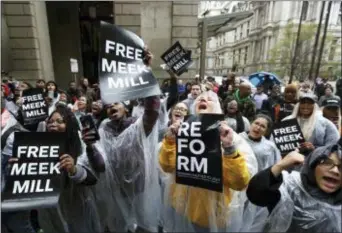  ?? JACQUELINE LARMA — THE ASSOCIATED PRESS ?? Protesters demonstrat­e in front of a courthouse during a hearing for rapper Meek Mill, Monday in Philadelph­ia. The city’s district attorney says Mill’s conviction­s should be vacated and he should have a new trial. The announceme­nt came during a hearing...