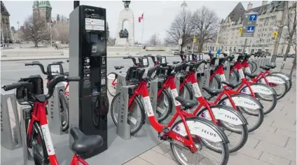  ?? PAT MCGRATH/ POSTMEDIA NEWS ?? Bixi bikes are being used in many cities across Canada including Ottawa’s national capital region. The company has run into financial trouble both in Montreal and Toronto. Though Vancouver’s bikes will be rented from Bixi, the new program will be...