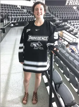  ?? Photo by Brendan McGair ?? Burrillvil­le native Giana Savastano proudly shows off the Providence College hockey jersey she will be wearing in a matter of weeks. Savastano is back playing hockey in the Ocean State after spending her high-school career at two out-of-state boarding...
