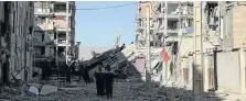  ?? Picture: REUTERS ?? DEVASTATIO­N: Damaged buildings are seen following an earthquake in Sarpol-e Zahab county in Kermanshah, Iran yesterday