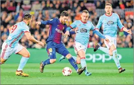  ??  ?? Barcelona's Lionel Messi (2 L) vies with Celta Vigo's Jonny Castro (L) and Slovak Stanislav at the Camp Nou stadium in Barcelona.