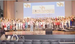  ?? Rachel Dickerson/The Weekly Vista ?? Music teacher Trista Cowart leads Cooper Elementary School students in singing "DoRe-Mi" during March Musical Madness at Erand Arts Center on Friday.