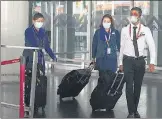  ?? SAMIR JANA/HT PHOTO ?? Air India crew members exit Netaji Subhas Chandra Bose Internatio­nal Airport at Kolkata on May 18.