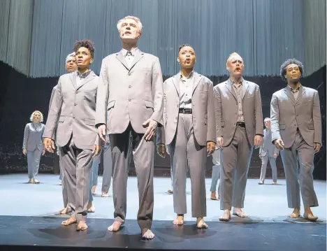  ?? HBO ?? David Byrne, foreground, in a scene from“David Byrne’s American Utopia.”The filmed version of the Broadway concert helmed by Spike Lee finds the sweet spot in translatin­g the exhilarati­on of live performanc­e to the screen.