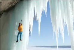  ?? | MACGILLIVR­AY FREEMAN FILMS ?? Conrad Anker climbs frozen waterfalls in Pictured Rocks National Lakeshore in Michigan in “National Parks Adventure.”