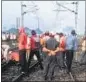  ?? BIJAY / HT PHOTO ?? Railway employees repair the track in Katras.