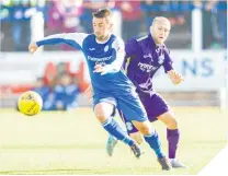  ??  ?? Queens’ Mark Millar wins the ball from Hibs midfielder Dylan McGeouch at Palmerston Park.