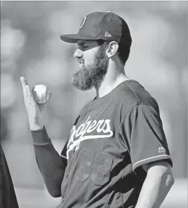  ?? Ross D. Franklin Associated Press ?? THE DODGERS’ Scott Van Slyke, who went one for two with a walk against the Milwaukee Brewers on Sunday, is considered by scouts to be a useful defender.