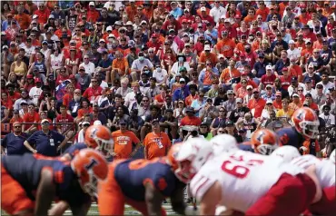  ?? CHARLES REX ARBOGAST — THE ASSOCIATED PRESS ?? Fans return to Memorial Stadium during the first half of an NCAA college football game between Illinois and Nebraska Saturday in Champaign, Ill. Fans headed back into stadiums this weekend and, along with binoculars, sunscreen and other essentials, many will be packing face masks.