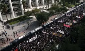  ??  ?? Protesters gather outside the Athens courthouse on Wednesday morning. Photograph: Orestis Panagiotou/EPA