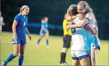  ?? (Courtesy Photo/JBU Sports Informatio­n) ?? John Brown women’s soccer players Lauren Walter and Sienna Carballo embrace after a Lady Golden Eagles goal Monday in a 4-0 win against Oklahoma City in the semifinals of the Sooner Athletic Conference Tournament at Alumni Field.