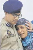  ?? WASEEM ANDRABI/HT ?? Jammu and Kashmir DGP SP Vaid (R) carrying the coffin of policeman Habibullah who died on Friday. He was critically injured in a militant attack in the J&K capital last week. (Right) A police officer comforts the wife of the slain cop.