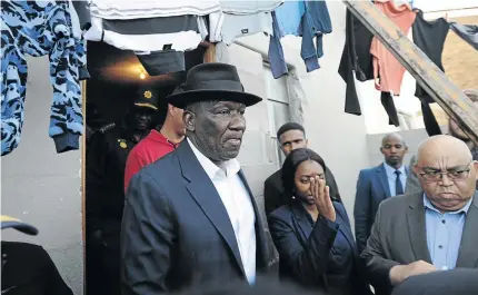 ?? /BRENTON GEACH/ GALLO IMAGES ?? Police Minister Bheki Cele visits Mitchells Plain where a house was petrol bombed by residents after the discovery of six-year-old Stacey Adams’s body on Sunday.