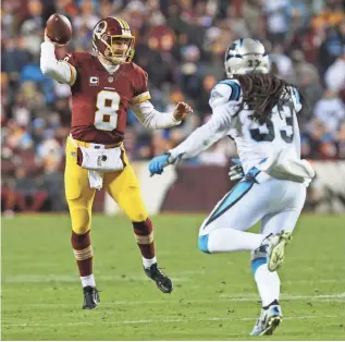  ?? GEOFF BURKE, USA TODAY SPORTS ?? Redskins quarterbac­k Kirk Cousins, pressured by Panthers safety Tre Boston, threw for 315 yards but had no completion longer than 23 yards in Monday’s loss.