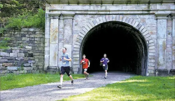  ?? During Cambria County’s Path of the Flood Historic Races on May 27, which follow the route of the 1889 flood from South Fork to Johnstown, participan­ts get to run through the Staple Bend Tunnel, the first railroad tunnel in the U.S. Cambria County Conserv ??