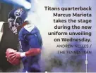  ?? THE TENNESSEAN ?? Titans quarterbac­k Marcus Mariota takes the stage during the new uniform unveiling on Wednesday. ANDREW NELLES /