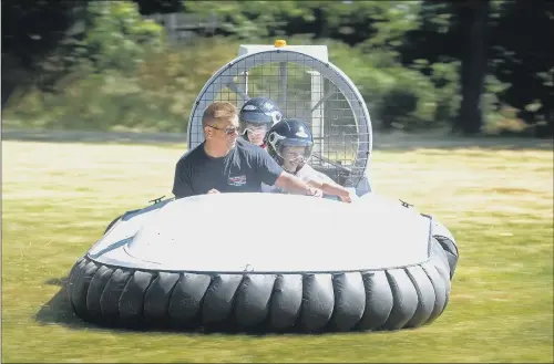  ?? PICTURE: TONY JOHNSON. ?? Activities at Prince Henry’s Grammar School in Otley included rides on hovercraft­s as well as an inflatable assault course. HEALTHY MINDS: