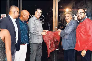  ??  ?? Director of Tourism Donovan White; councillor for the Spring Gardens Division, Dwight ‘Debo’ Crawford; The Mayor of Montego Bay, Councillor Homer Davis; Sizzling Slots Limited CEO Gassan Azan; and director of operations at Sizzling Slots Limited, Robin Perkins, are seen here cutting the opening ribbon on 100 Montego Bay.