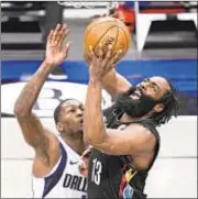  ?? AP ?? James Harden scores 29 points but is without Kyrie Irving and Kevin Durant as Nets’ eight-game winning streak ends.