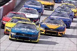  ?? WADE PAYNE / AP ?? Ryan Blaney (12) leads the field to start a NASCAR Cup Series auto race March 17 in Bristol, Tenn.