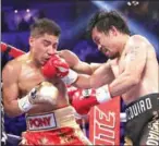  ?? AFP ?? Manny Pacquiao lands a right on Jessie Vargas in their WBO welterweig­ht championsh­ip fight on Saturday.