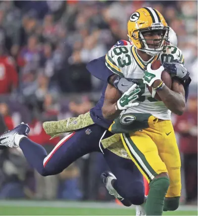  ?? MARK HOFFMAN / JOURNAL SENTINEL ?? Marquez Valdes-Scantling hauls in a 51-yard reception against the Patriots.