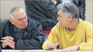  ?? MIKE CARDEW PHOTOS / AKRON BEACON JOURNAL / TNS ?? Consolidat­ed Freight retirees Dick Meadows, 80 (left), and Joe Mardula, 62, talk at a Retired Teamsters Fellowship Club meeting Feb. 4 in Akron. The legislatio­n’s exact effects are unknown for now.