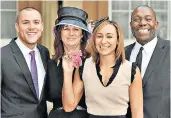  ??  ?? With her husband Andy Hill and her parents, Alison and Vinny, after being presented with an MBE in 2011