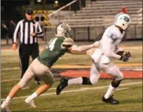  ?? PAUL DICICCO — FOR THE NEWS-HERALD ?? Lake Catholic’s Logan Campola tries to tackle Benedictin­e’s Logan Hyduke on Oct. 13 at Jerome T. Osborne Sr. Stadium.