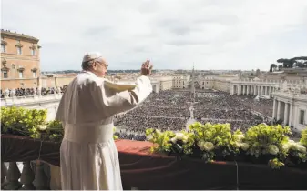  ?? Vatican Media ?? Pope Francis gives his “Urbi et Orbi” Easter message from the balcony of St. Peter’s Basilica to about 80,000 faithful at the Vatican. The attendees underwent heavy security checks.