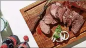  ?? STACY ZARIN GOLDBERG/ THE WASHINGTON POST ?? Coca-Cola Smoked Beef Tenderloin.