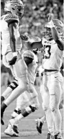  ?? JOHN RAOUX/AP ?? Florida State quarterbac­k Jordan Travis, right, celebrates with quarterbac­k James Blackman after Travis scored on a 1-yard run against Florida during the first half Nov. 30, 2019, in Gainesvill­e.