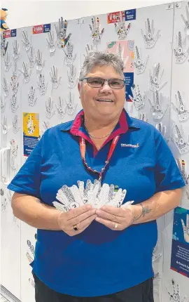  ?? ?? Officework­s Townsville store business manager Denise Brown is pleased with the support for their Wall of Hands appeal.