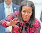  ?? — AP ?? In this, file photo, first lady Michelle Obama waves as she departs after a holiday event at Children’s National Health System in Washington.