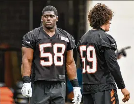  ?? NICK GRAHAM / STAFF ?? Bengals defensive end Carl Lawson (58) appears poised to take the next step from a nickel rush specialist to an every-down player after a breakout rookie year.