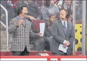  ?? CHRISTIAN PETERSEN — GETTY IMAGES, FILE ?? Reporters Tyson Nash and Drew Remenda, right, during a 2013 game between the Coyotes and Sharks in Glendale, Arizona. Remenda will take on an expanded role this season during San Jose’s broadcasts.