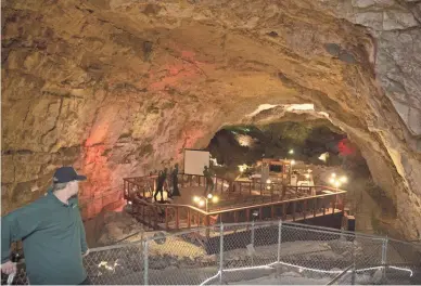  ??  ?? Levi Goldsmith (lead tour guide) looks down on the Cavern Suite, June 14, 2016, at the Grand Canyon Caverns in Peach Springs.