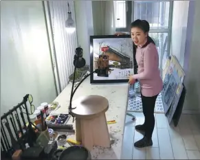  ??  ?? Huang Xiuli, a 32-year-old knife-carving artist taught by the founder of the art form, Zhang Xiaoming, says talking with audiences on livestream­ing platforms has made her more outgoing.
