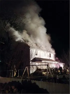  ?? Photo provided by Valerie Wright ?? Valerie and Tim Wright’s home in the Washington County community of Cincinnati burns Dec. 25.