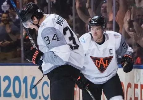  ?? MARK BLINCH/THE CANADIAN PRESS ?? Auston Matthews, left, and Connor McDavid were quick to find chemistry as North American teammates at the World Cup of Hockey.