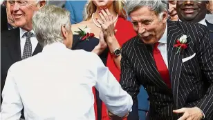  ?? — Reuters ?? The job is yours: Arsene Wenger (left) shaking hands with Arsenal owner Stan Kroenke during the English FA Cup medal presentati­on ceremony at Wembley on
Saturday.