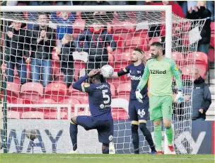  ??  ?? HEAD-BANGER Derby’s Fikayo Tomori is distraught after Jayden Bogle’s late gift to Boro