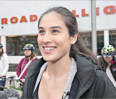  ?? GORD WALDNER ?? Caitlyn Kirkpatric­k, a Grade 12 internatio­nal baccalaure­ate student, partnered with Care and Share to help put bicycles into the hands of seven of her deserving classmates at Bedford Road Collegiate on Friday.