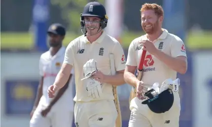  ?? Photograph: Sri Lanka Cricket ?? Dan Lawrence (left) and Jonny Bairstow celebrate England’s victory in Galle on day five of the first Test.